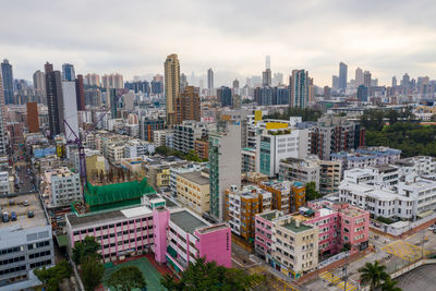 High angle view of buildings in city against sky