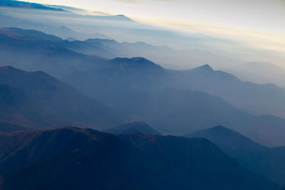 Scenic view of mountains against sky during sunset