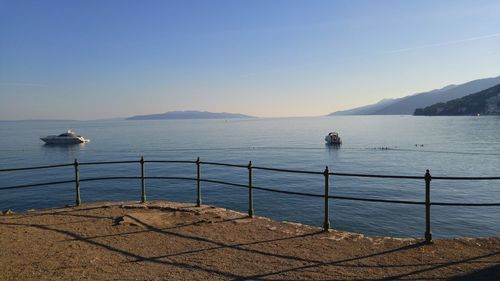 Scenic view of sea against clear blue sky