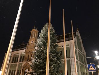 Low angle view of illuminated building at night