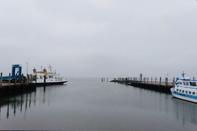 Pier on sea against sky