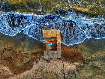 High angle view of sea by mountain