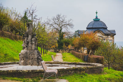 Trees and built structure against sky