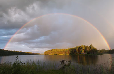 Rainbow over calm lake