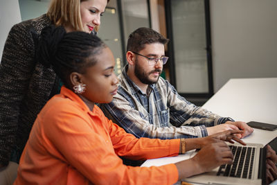 Side view of mother and daughter at home