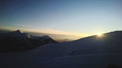 Scenic view of mountains against sky during sunset