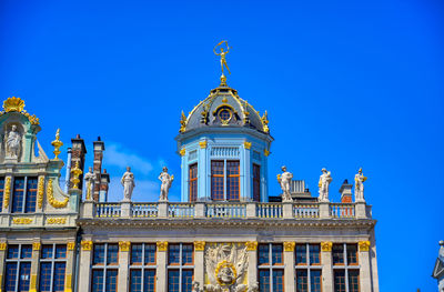 Low angle view of building against blue sky