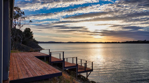 Scenic view of lake against sky during sunset