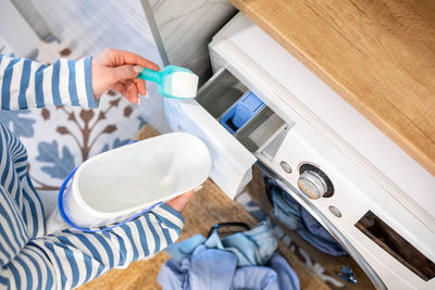 Cropped hand of person cleaning equipment