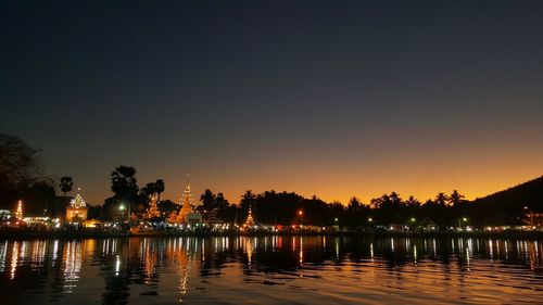 Reflection of illuminated buildings in water