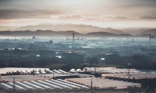 High angle view of cityscape against sky during sunset