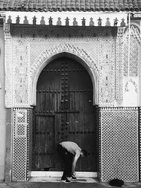 Woman standing in front of building