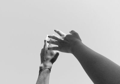 Close-up of man touching against white background