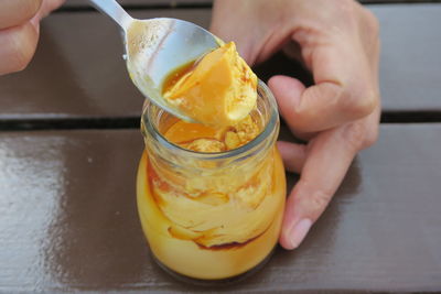 Close-up of person holding pudding