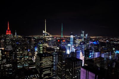 Illuminated buildings in city at night