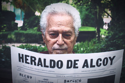 Close-up portrait of man with text