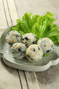 Korean seaweed rice balls or jumeokbap with sesame seed, sesame oil, and vegetable