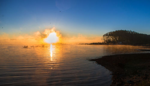 Scenic view of sea against sky during sunset