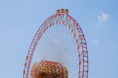 Low angle view of ferris wheel against clear sky