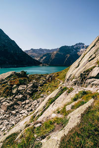 Scenic view of lake and mountains against clear sky