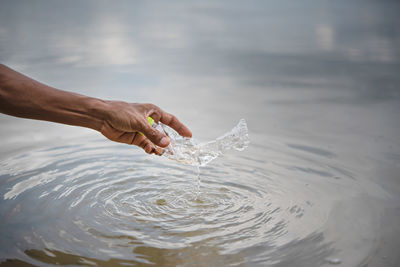 Person hand in water
