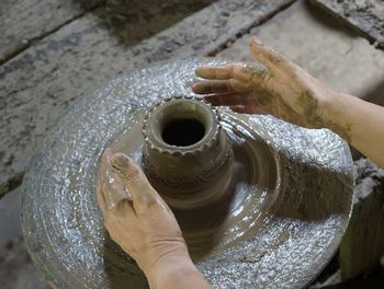 High angle view of woman hand sculpting claywork