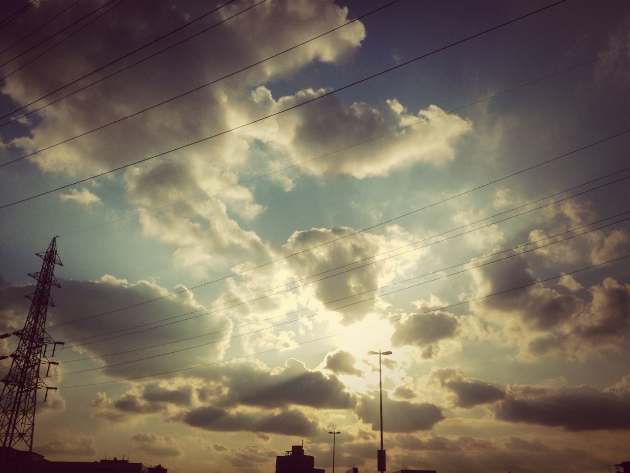 power line, electricity pylon, low angle view, power supply, electricity, sky, cable, cloud - sky, connection, silhouette, fuel and power generation, cloudy, technology, sunset, cloud, power cable, nature, beauty in nature, weather, no people