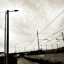 Cars on road against sky