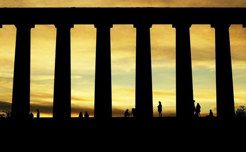 Silhouette of building at sunset