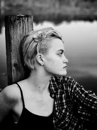 Close-up portrait of young woman looking away