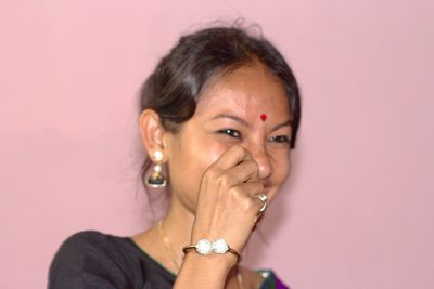 Close-up portrait of a smiling young woman