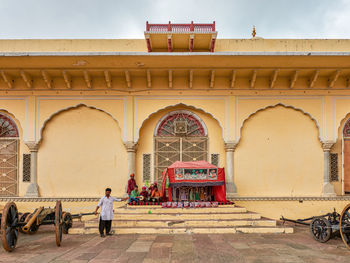 People outside temple in historic building