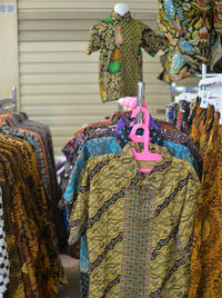 Close-up of clothes hanging on wall