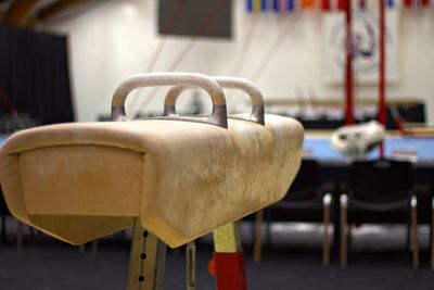 Close-up of empty chairs on table