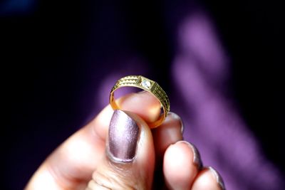 Close-up of cropped hand holding text