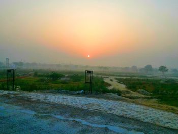 Scenic view of landscape at sunset