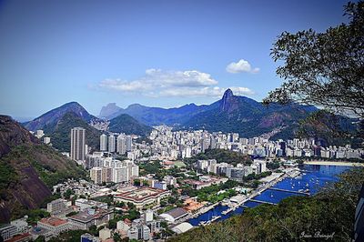 Cityscape with mountain range in background