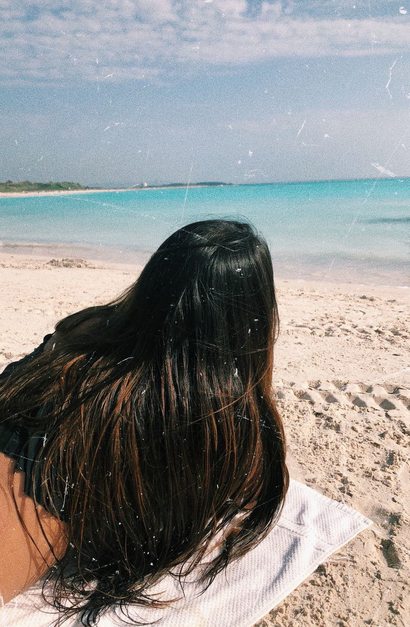 beach, sea, land, sky, water, rear view, horizon over water, hair, one person, horizon, long hair, lifestyles, women, leisure activity, sand, hairstyle, real people, nature, scenics - nature, outdoors, human hair