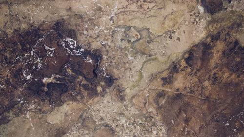 High angle view of water flowing through rocks