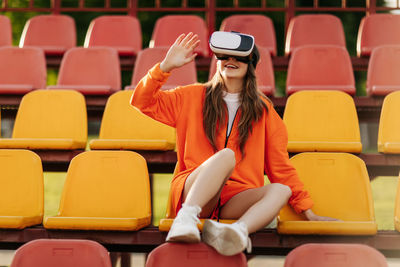 A young athlete wearing virtual reality glasses, dressed in sportswear