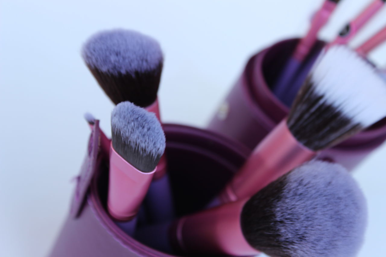 close-up, focus on foreground, still life, selective focus, blue, day, purple, no people, pink color, studio shot, outdoors, fragility, white background, reflection, flower, nature, medium group of objects, detail, hanging