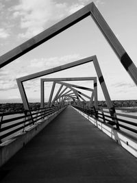 View of footbridge against sky