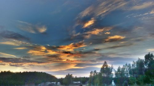 Scenic view of landscape against sky at sunset