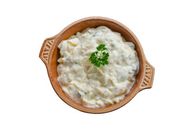 High angle view of food in bowl against white background