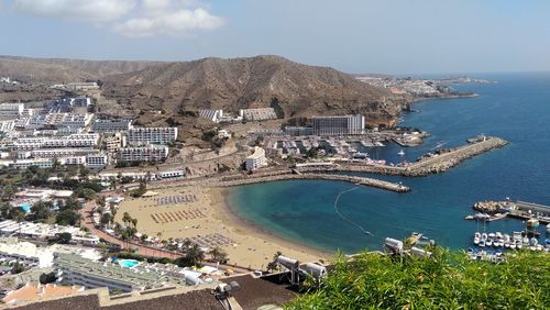 High angle view of townscape by sea