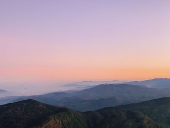 Scenic view of silhouette mountains against sky during sunset