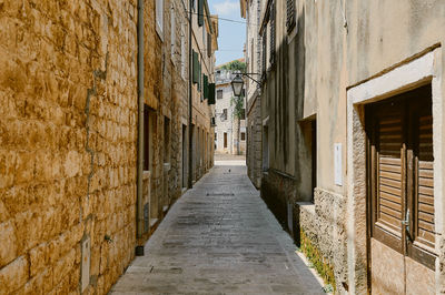 Narrow alley amidst buildings