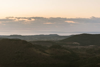 Scenic view of landscape against sky during sunset