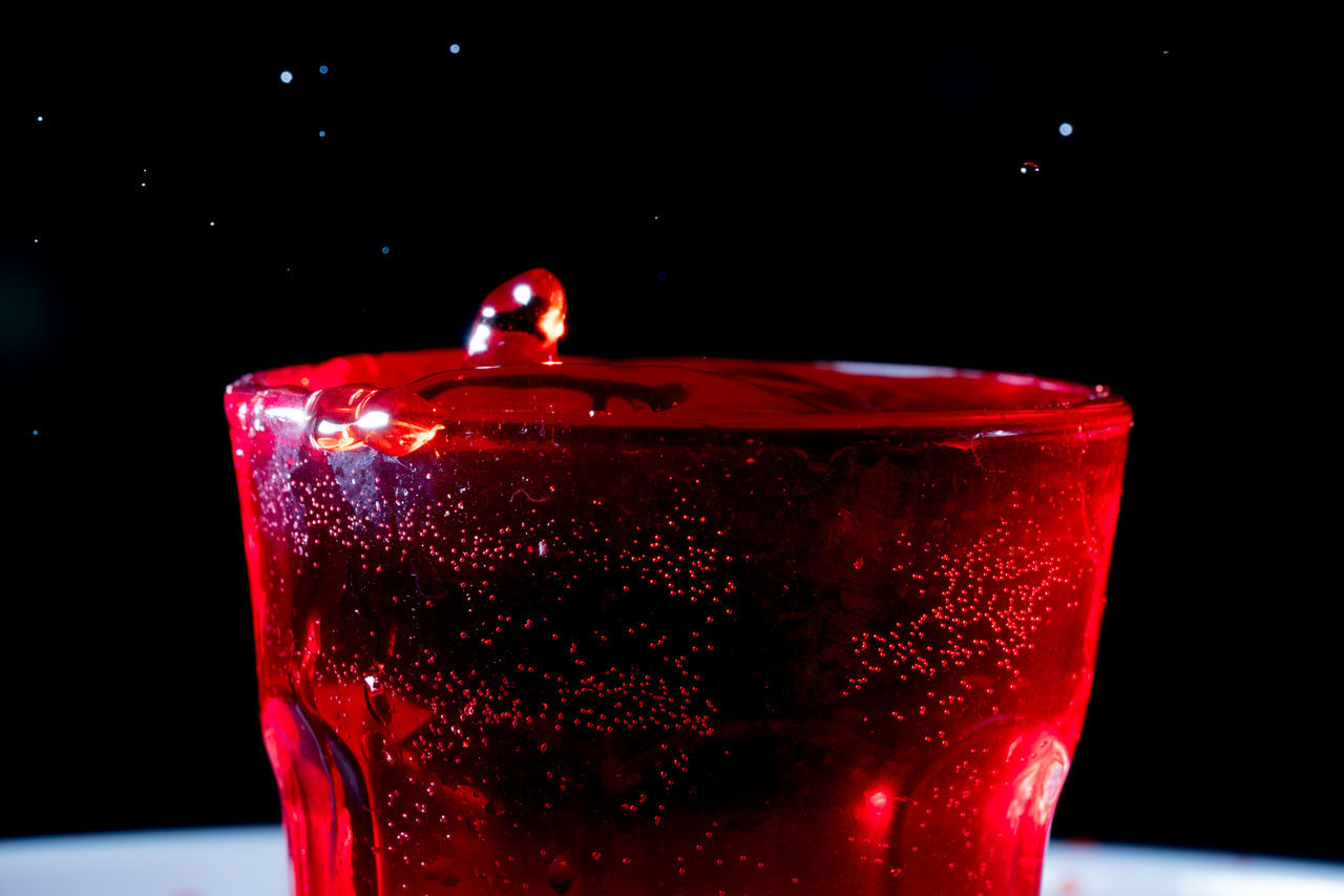 CLOSE-UP OF WATER DROPS AGAINST BLACK BACKGROUND