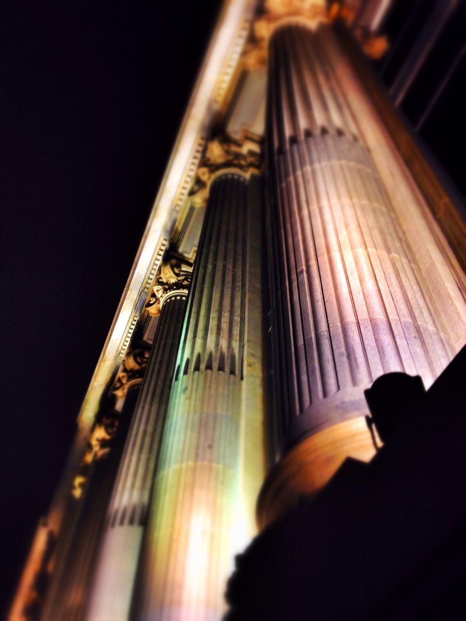 indoors, illuminated, escalator, night, low angle view, railing, steps, steps and staircases, built structure, architecture, dark, staircase, diminishing perspective, the way forward, no people, high angle view, selective focus, shadow, light - natural phenomenon, lighting equipment